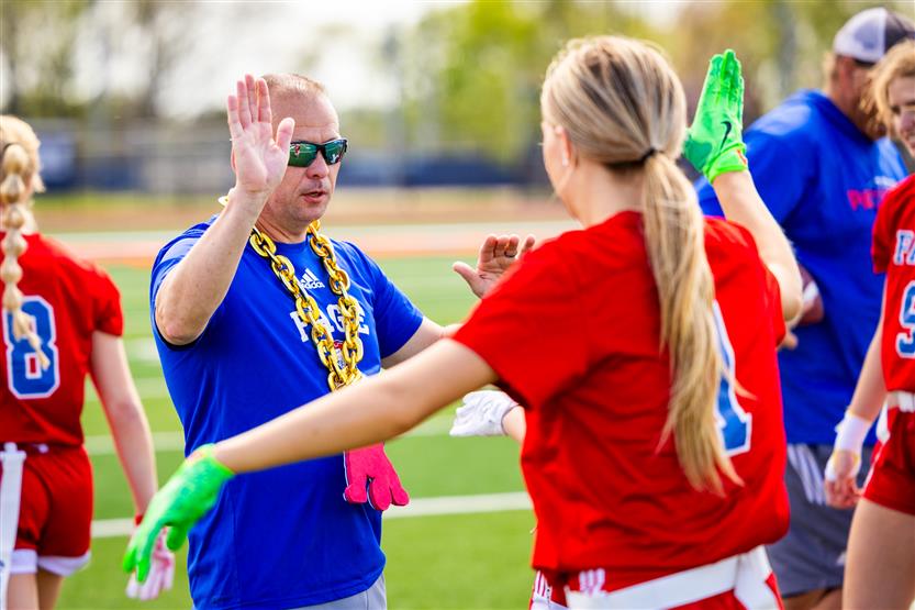 Students play flag football